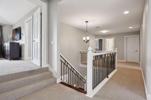 Upstairs, you will find four bedrooms, three bathrooms and the option for a future BONUS room.