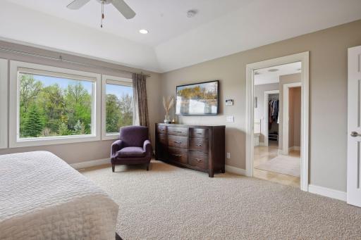 The tray ceiling gives the primary bedroom a spacious feel.