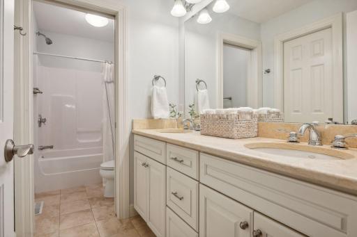 Bedroom 3 and 4 share this double sink bathroom with a separate shower and toilet area.