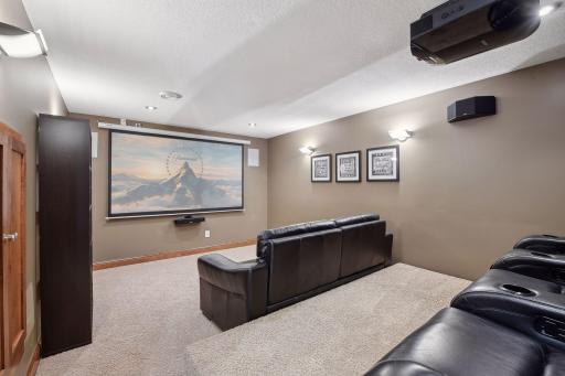 No need to head to the theatre when you have your very own theatre room complete with a Sony projector and surround sound.