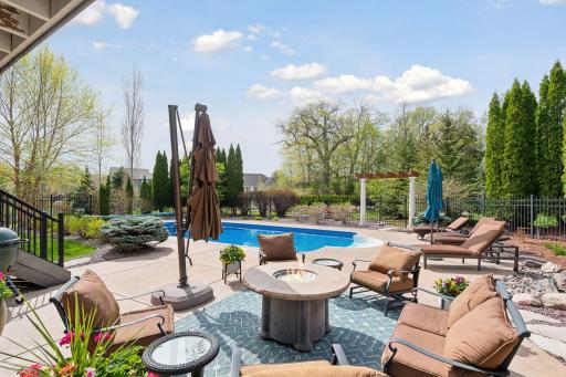 Professional landscaping, an oversized pool and fire pit area create the perfect after golfing experience!