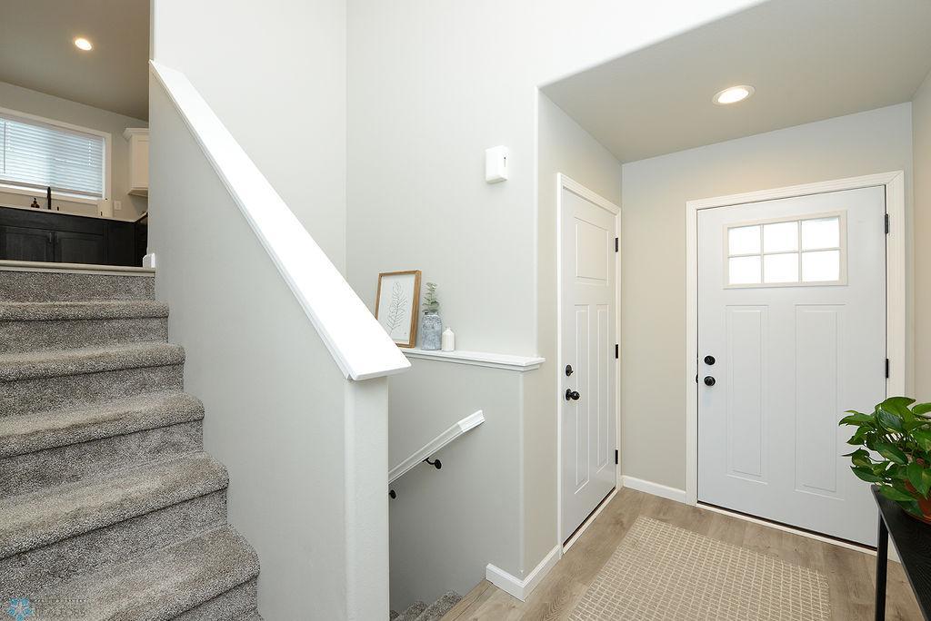 Foyer to lower level and garage