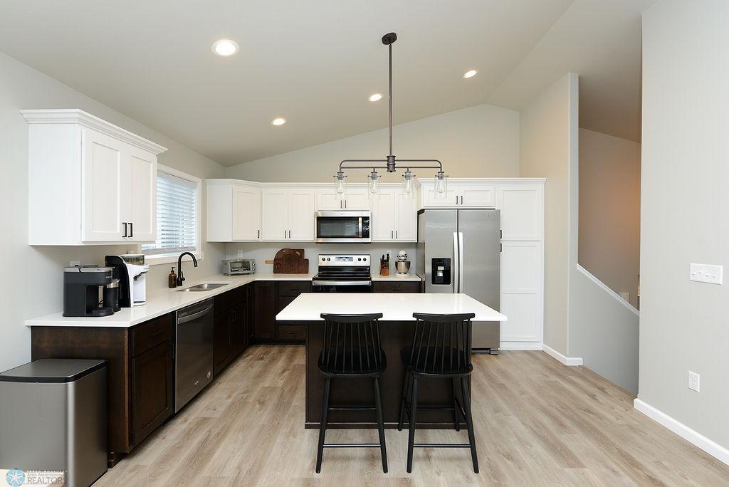 White upper cabinets & dark lower cabinets