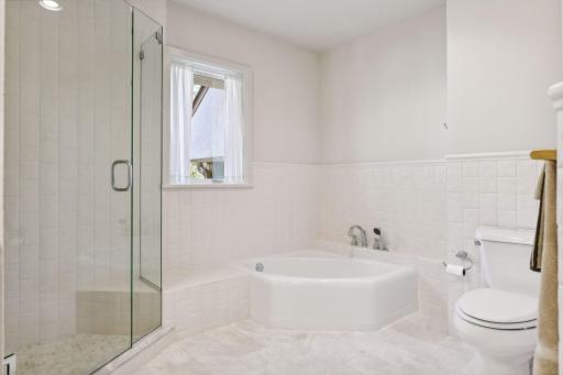The bathroom was updated with an expanded, subway tile shower, heated tile floors and a new princess bathtub