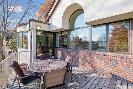 A new sliding glass door walks out to the deck