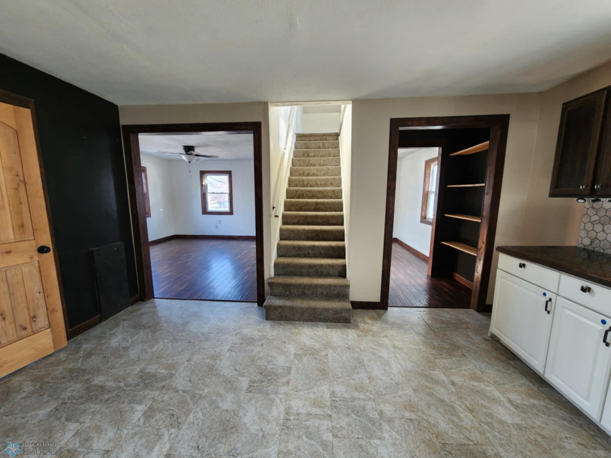 Kitchen to living room and upstairs