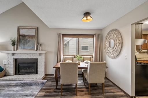 Nestled beside a large window, the dining room is filled with natural light, creating a cheerful atmosphere that enhances every meal.