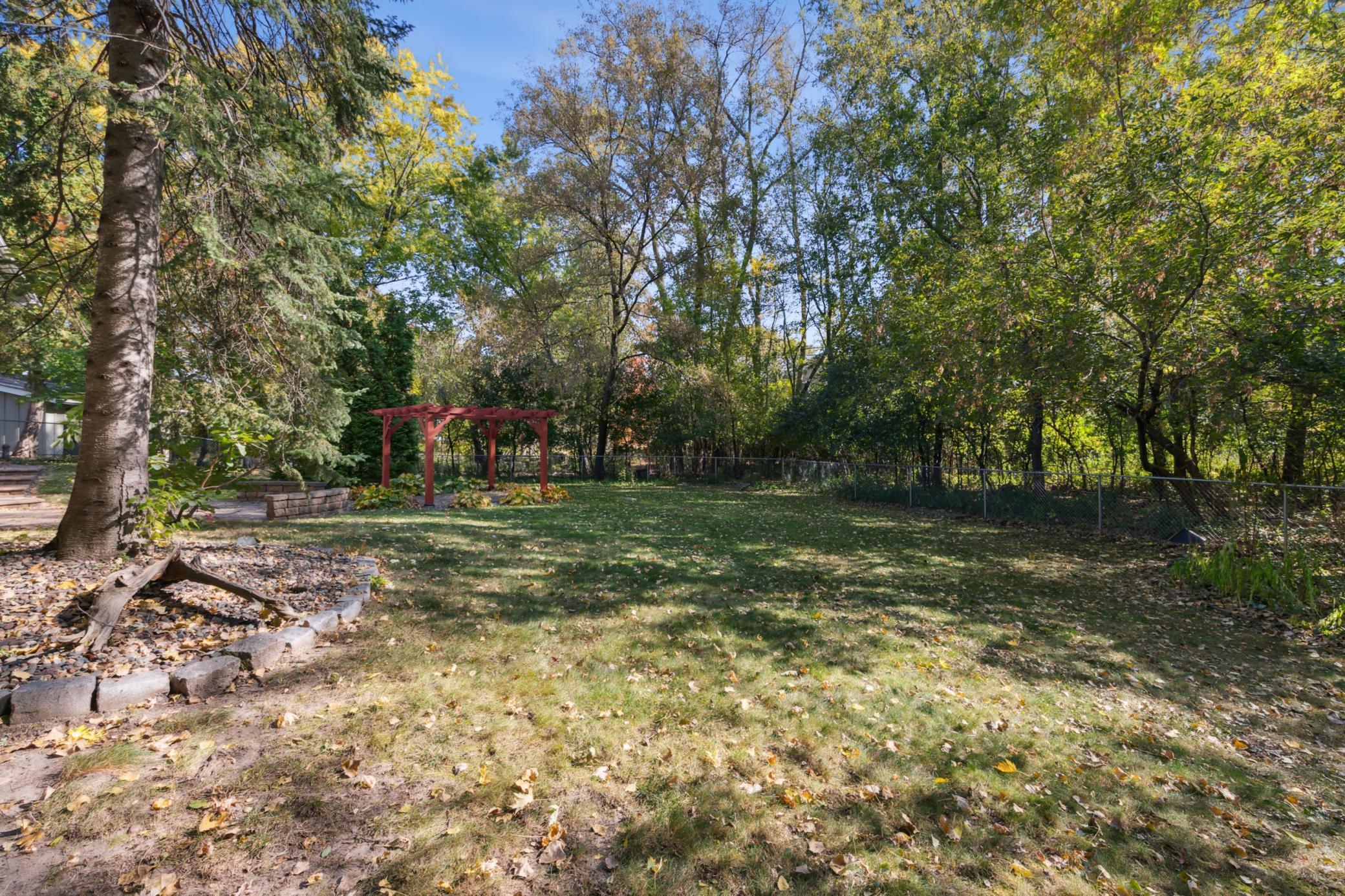 Behind the home you will find a very private, spacious fenced back yard with patio and lots of green space for gardening.