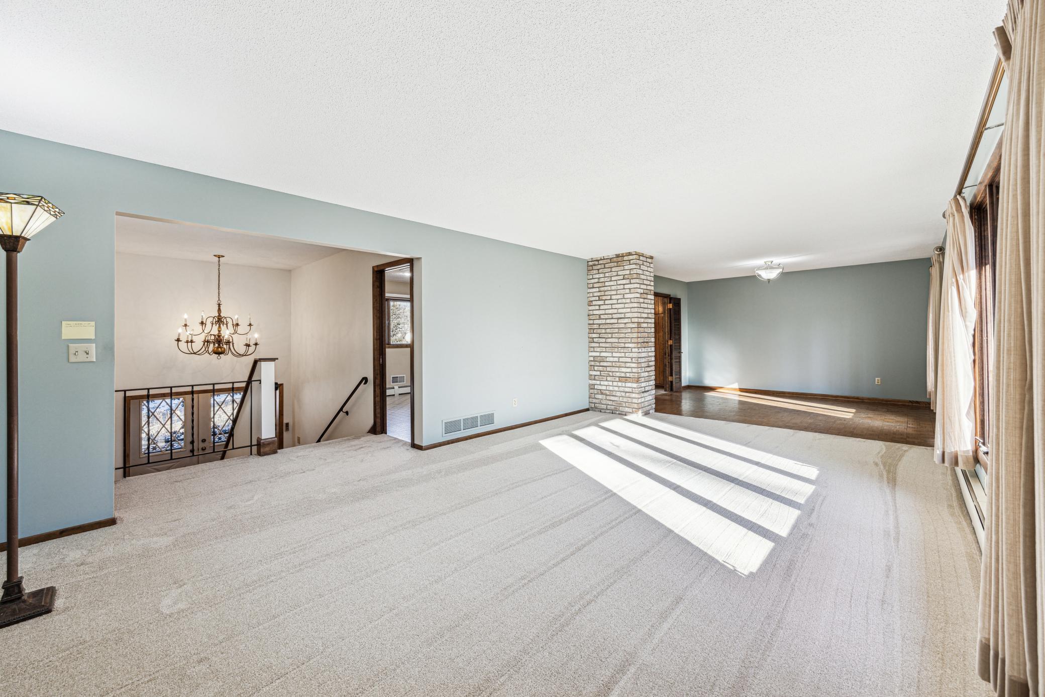 The Main level has new carpeting. The open concept Living/Dining areas overlook the back yard.