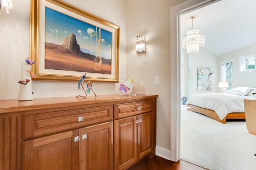 Private main floor Owner's Suite is tucked away with brand new carpets, updated lighting and a newly remodeled owners private bathroom.