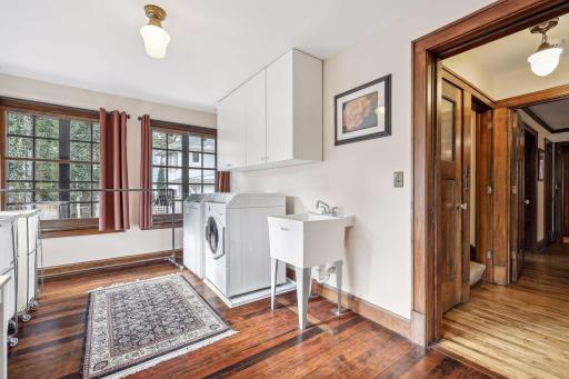 A sunny second level laundry was originally a fourth bedroom on this level. A closet offers additional storage. Plenty of space for laundry and a craft/workspace.