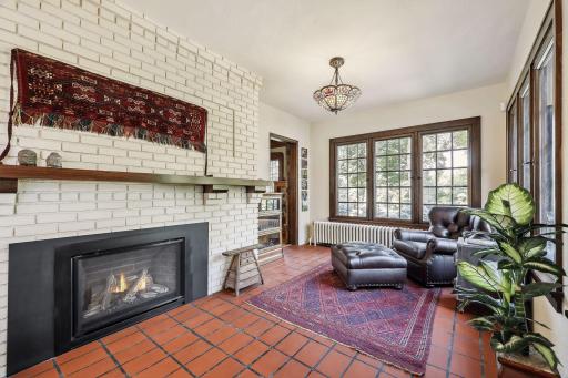 A second main level sunroom is adjacent to the living room. Gas fireplace, direct access to back patio, views of Lake of the Isles. East, west, and northern exposure. A cozy sitting room and second office.