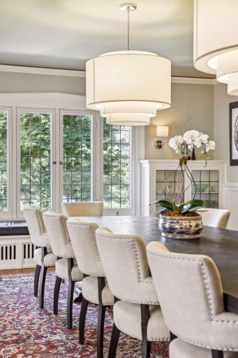 Gorgeous natural light pours through south and west facing windows with serene views of Lake of the Isles.
