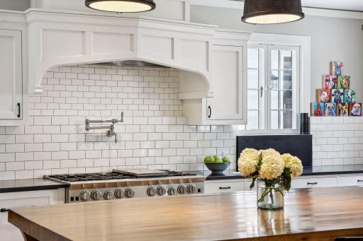 Commercial grade exhaust hood, pot filled and large range. Wonderful natural light pours through east and south-facing windows.
