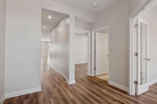 Spacious entry allows easy access for guests and provides room to decorate. The French doors lead to guest bedroom/den.