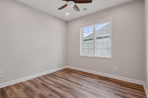 Second of two guest bedrooms - also features a closet organizer and overhead fan.