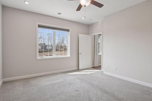 Primary bedroom suite also has views of the backyard.