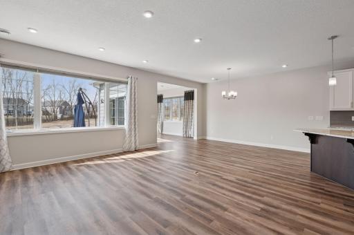 The dining area next to the kitchen is spacious and allows for a large table.