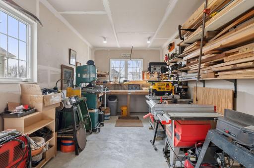 This is the fourth stall of the heated garage - presently used as a workshop. This extra long 4th stall was a custom upgrade to this home. This space is in addition to your three-stall across garage. AMAZING.
