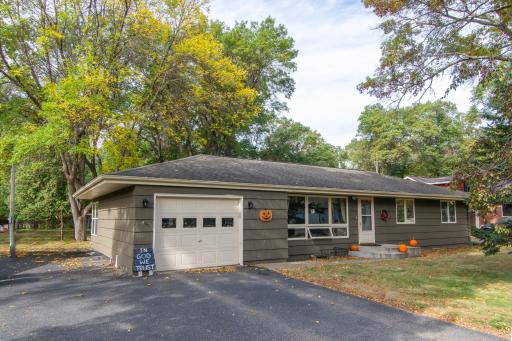 Welcome to 13699 Memorywood Drive! There is a one stall garage and an extra parking space along the north side of the home.
