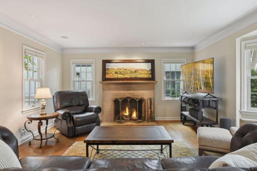 Woodburning fireplace in formal living room.