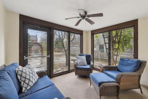 3 season porch with screens and glass shutters off of the living room.