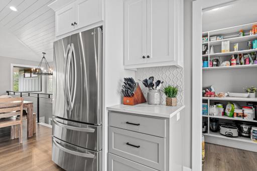 Spacious pantry just off the kitchen offers dynamite storageâperfect for keeping all your treats, essentials, and kitchen must-haves organized and within easy reach.
