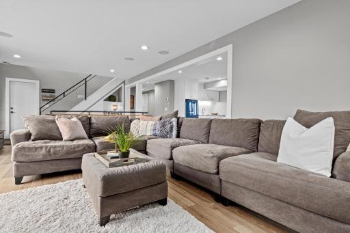 The lower-level family room overlooks the backyard and Ramsey County green space. Cuddle up for your favorite movie or the big game.