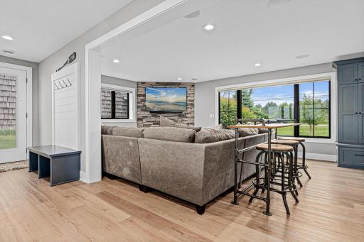 The side door allows easy access to the lake and the family room provides another great space for movie watching.