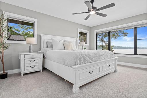 Primary suite has spectacular views of the lake- and newer everything. Carpet, paint, windows, ceilings, light fixtures and more.