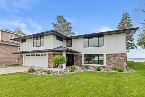 Stunning exterior with new siding, roof, windows, and professional landscaping (2022)âevery detail thoughtfully updated for maximum curb appeal and lasting quality.
