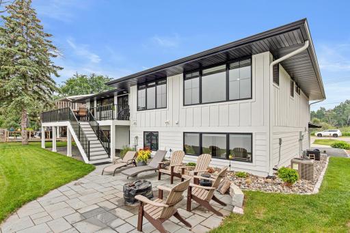 Extensive landscaping, custom patio, and a maintenance-free deck create multiple inviting spaces to relax, entertain, and fully embrace the lake lifestyle.