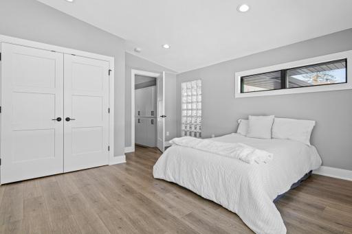 Second bedroom on the upper level. This spacious room has its own 3/4 bathroom and views of the backyard.