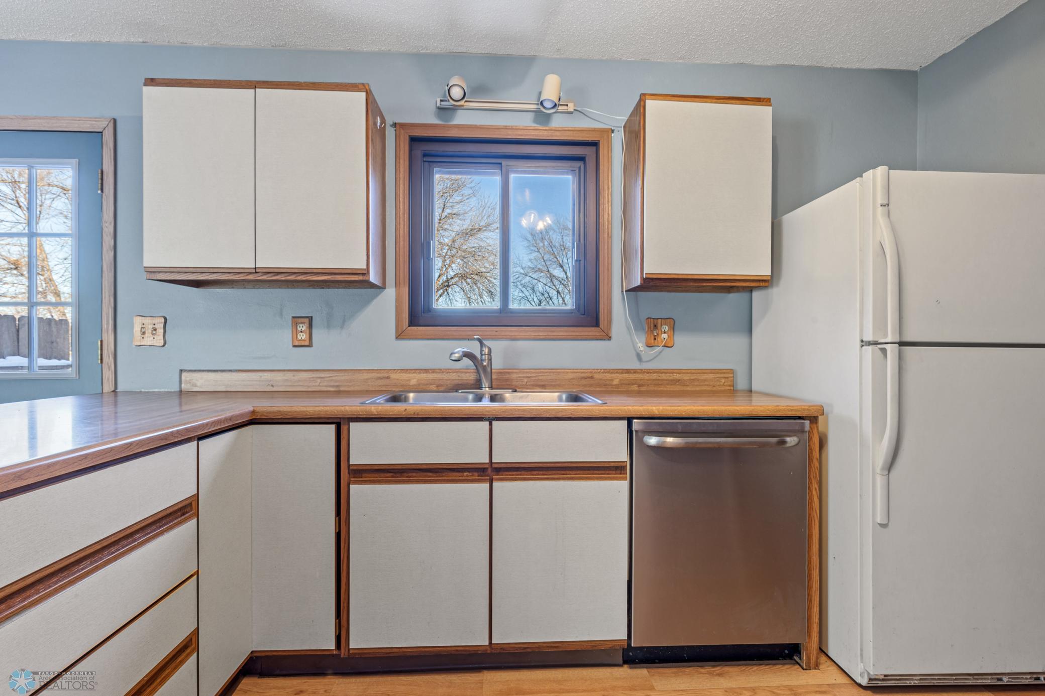 Kitchen - window above sink looks out at back yard
