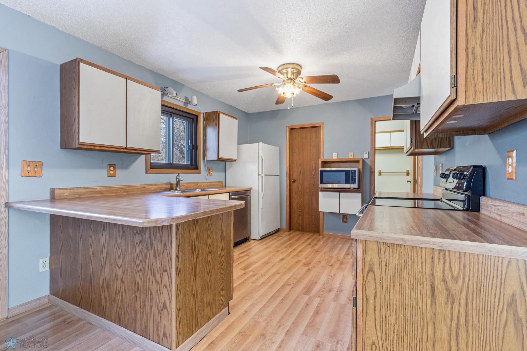 Kitchen with large walk-in Pantry