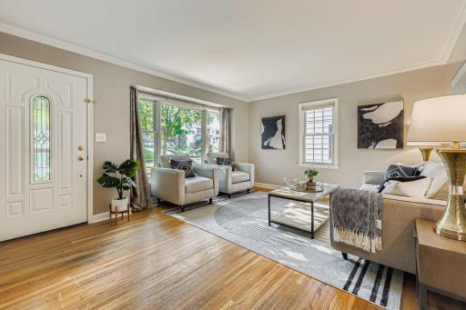 Gleaming hardwood floors and fresh paint in the living room. There is also a convenient coat closet right inside the front door, with room for a bench or hall tree.