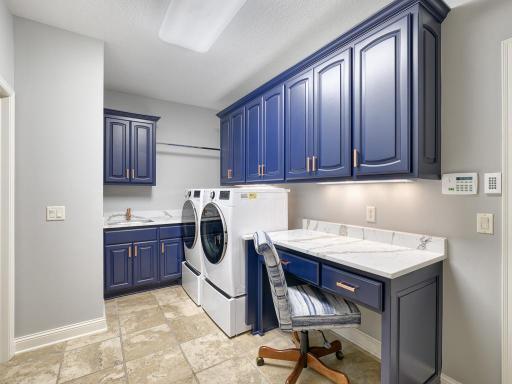 The main floor laundry room offers great storage!