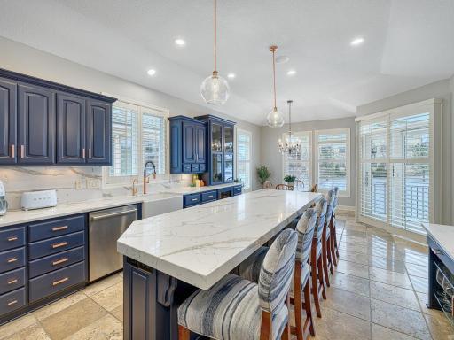 The kitchen flows into the informal dining area.