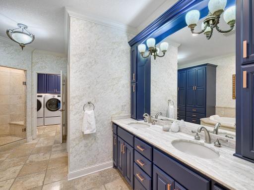 Primary bath has easy access to the laundry room