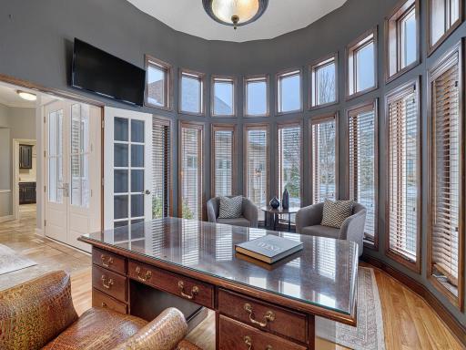The impressive main floor office is a great work from home space!