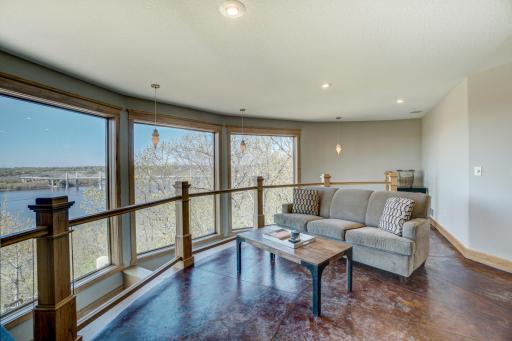 The upper level offers incredible potential as a private ownerâs retreat. Picture yourself starting each day with coffee in the loft, overlooking the main living area and enjoying spectacular river views.