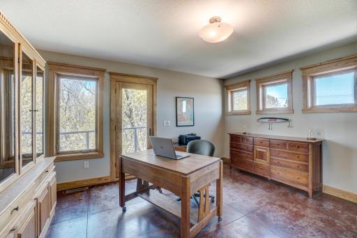 Bedroom 2 upper level with its own new deck to take in the serene surroundings.