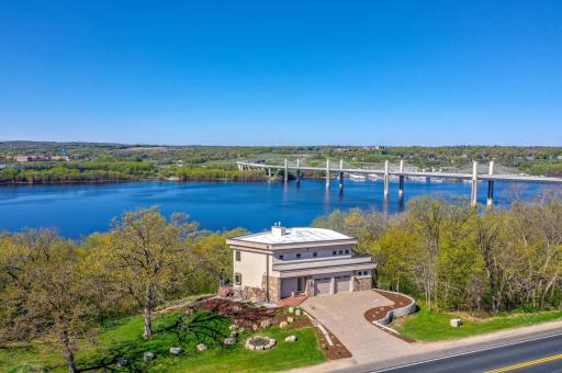 Experience unparalleled riverfront living on the St. Croix in this custom-designed contemporary home, where exquisite woodwork and meticulous attention to detail complement stunning views from nearly every room!