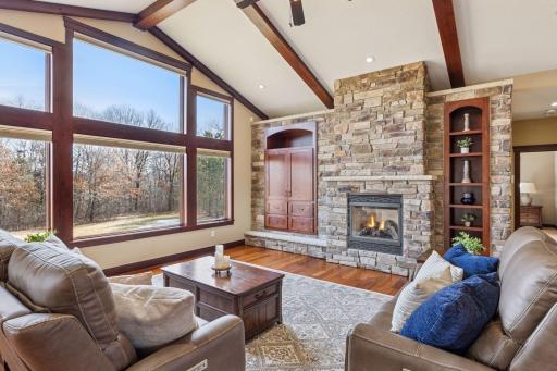 The vaulted and beamed great room greets you as you enter the home. Complete with full stone fireplace and built-ins and an amazing view of the private backyard.