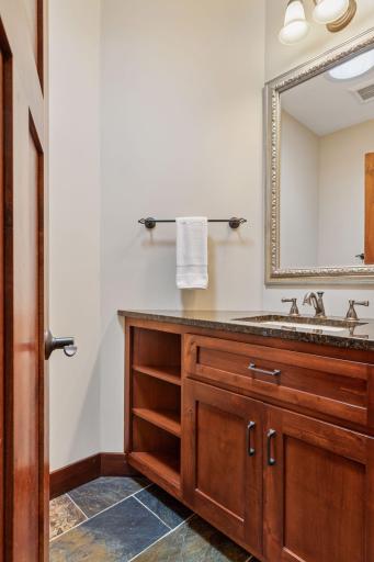 Main floor powder room with heated floors.