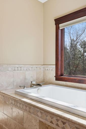 Relax and soak the cares away overlooking nature.