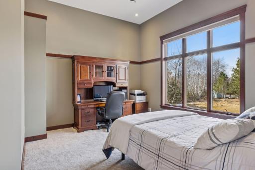 The main level office boasts 11+ foot ceiling, French doors and closet. Large enough to offer a combination of office and additional guest space, if needed.