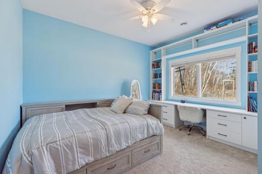 One of the four bedrooms on this level.