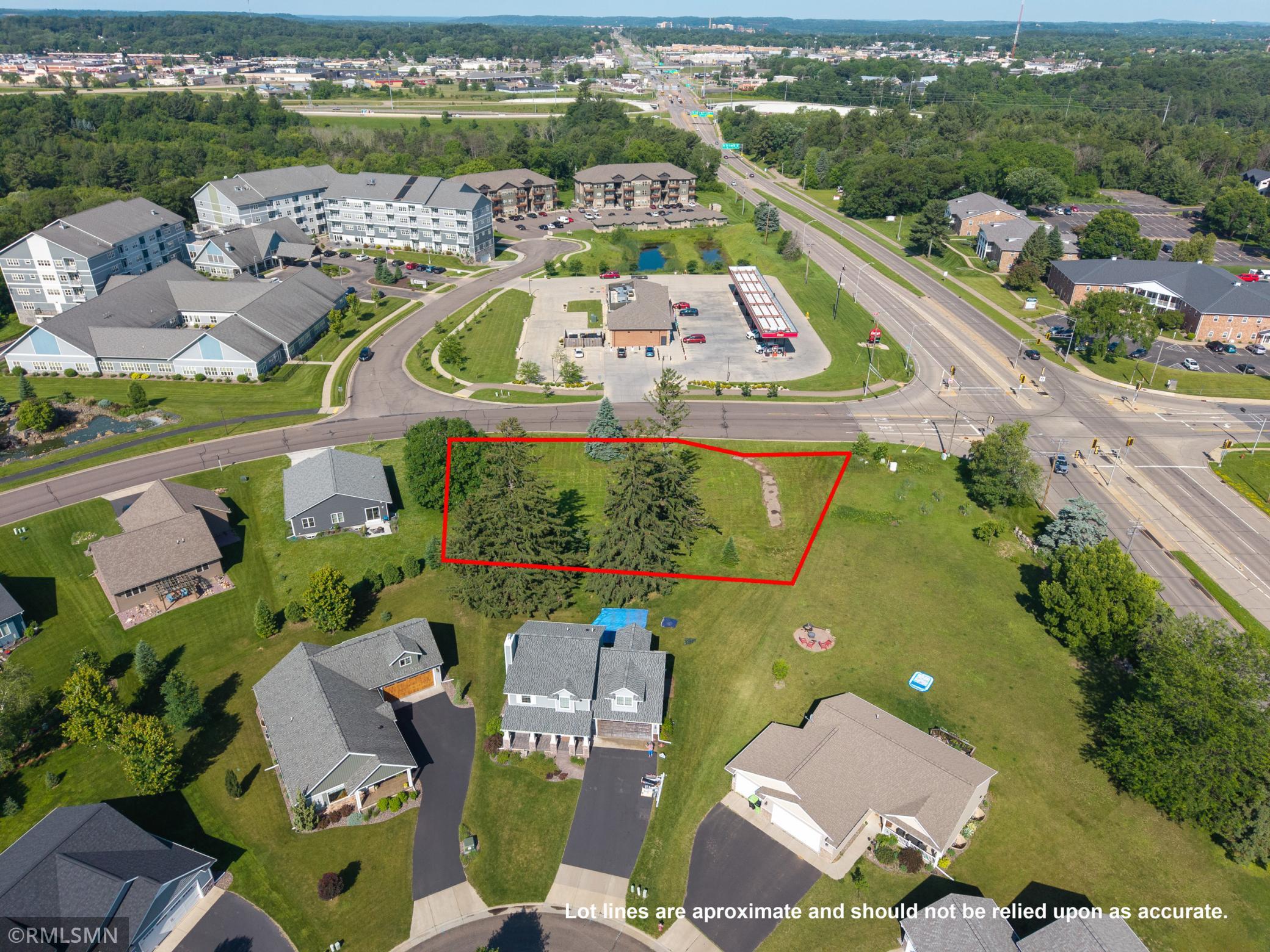 Another aerial perspective of the lot with drawn lot lines, offering a broader view of the neighborhood and proximity to nearby developments.