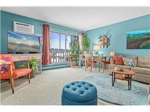 Welcome home! Imagine spending time in your beautiful living room overlooking green space and a lake!